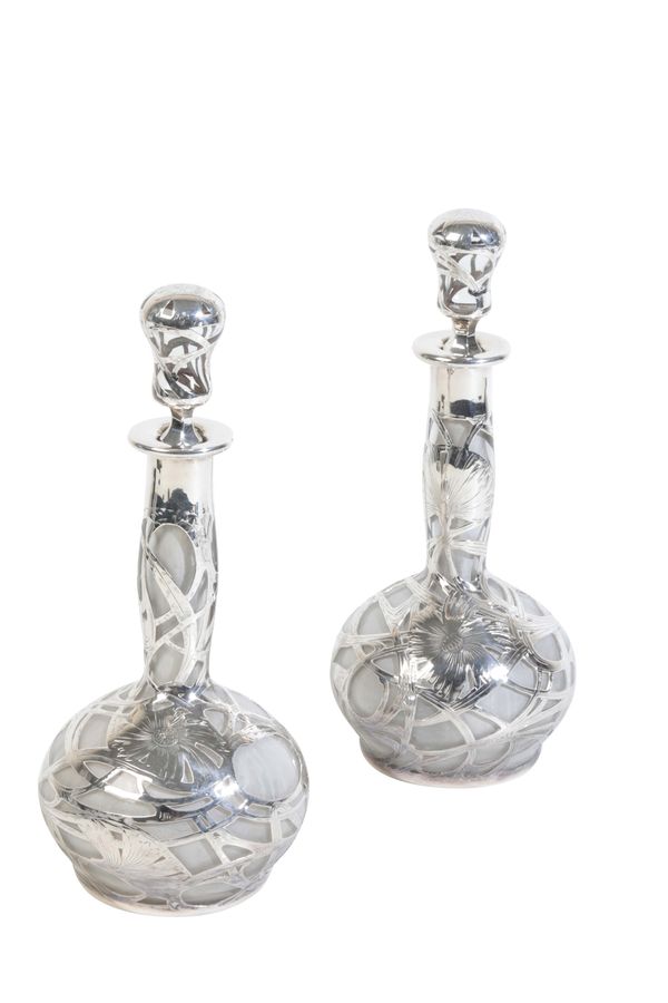 A PAIR OF EARLY 20TH CENTURY GLASS BOTTLES,