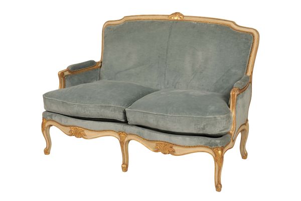 A CARVED, PAINTED AND PARCEL GILT WOOD CANAPE IN LOUIS XV/ XVI TRANSITIONAL STYLE,