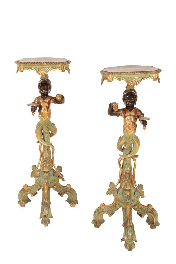 A PAIR OF VENETIAN CARVED, PAINTED AND PARCEL GILTWOOD FIGURAL TORCHERE STANDS,