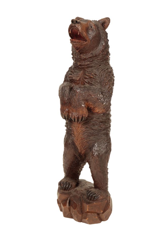 A 'BLACK FOREST' CARVED LINDEN WOOD MODEL OF A BEAR,