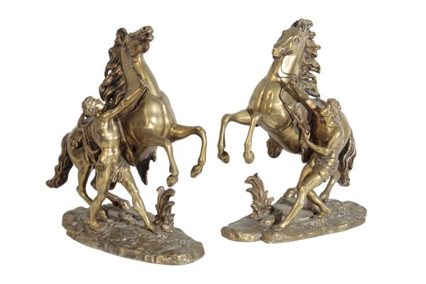 AFTER GUILLAUME COUSTOU THE ELDER, PAIR OF GILT METAL MODELS OF THE MARLY HORSES,