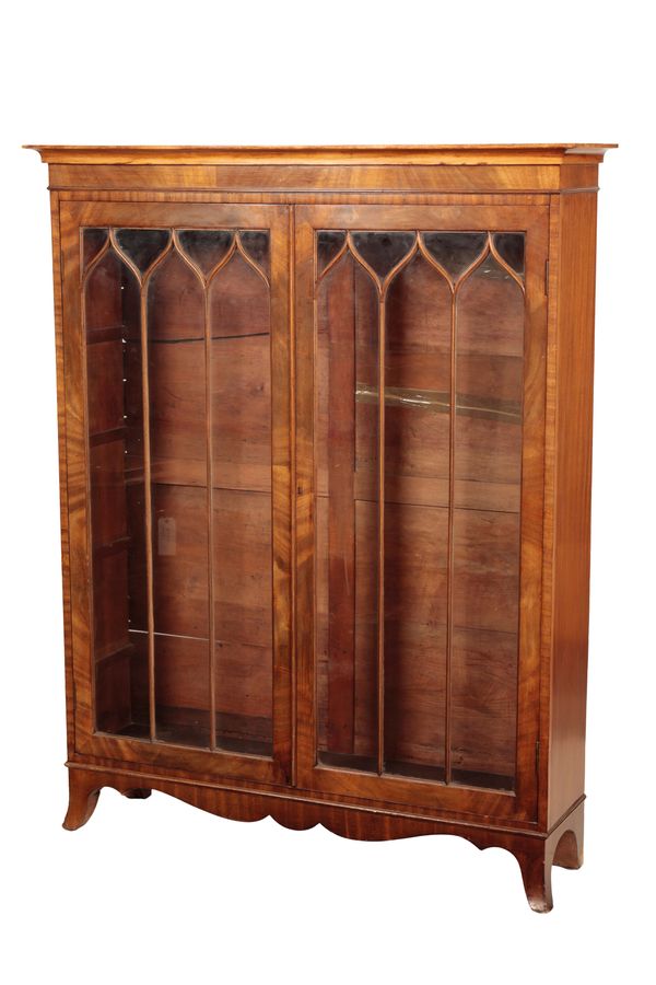 A VENEERED AND GLAZED BOOKCASE IN GEORGE III TASTE,