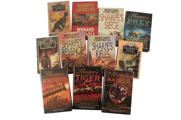 A COLLECTION OF TWENTY-ONE BERNARD CORNWELL  'SHARPE' BOOKS