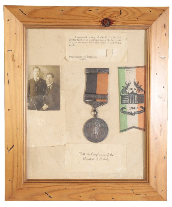 A 1917 -21 ACTIVE SERVICE MEDAL ( BLACK & TAN) WITH CORMAC BAR.