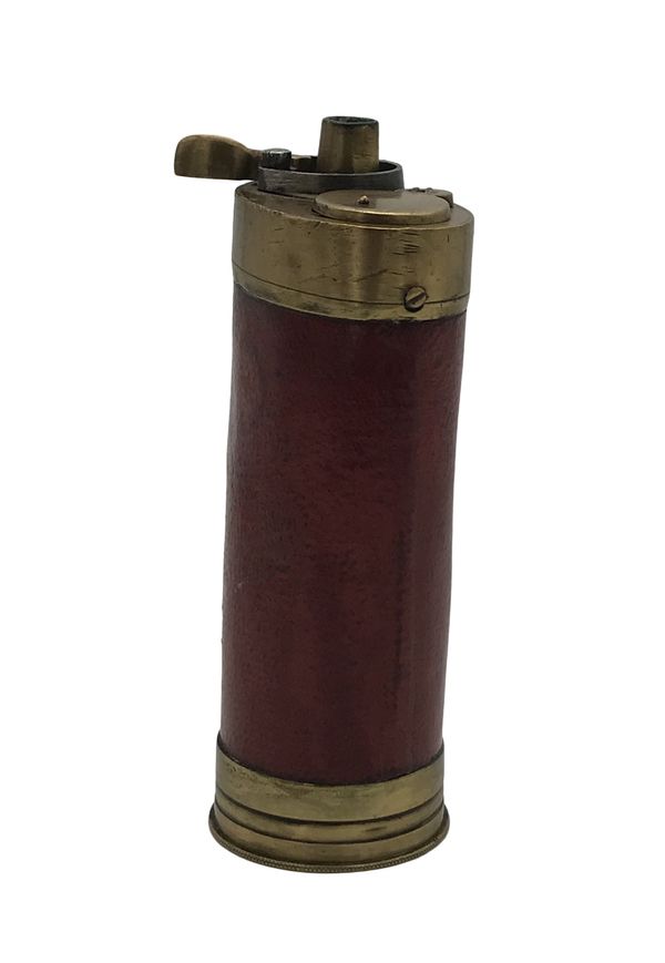 A BRASS AND LEATHER BOUND POWDER FLASK