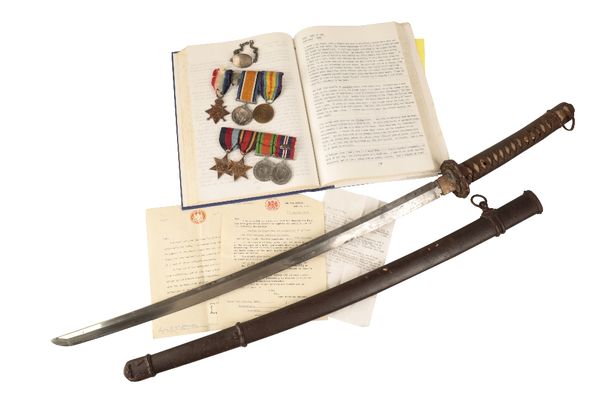 A COLLECTION OF MEDALS TO THE HOLMES FAMILY, ALONG WITH A 'WAR TROPHY' JAPANESE SWORD
