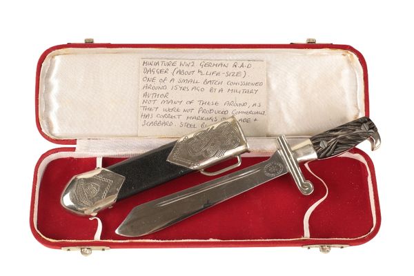 A MINIATURE COPY OF A WORLD WAR II GERMAN RAD DAGGER