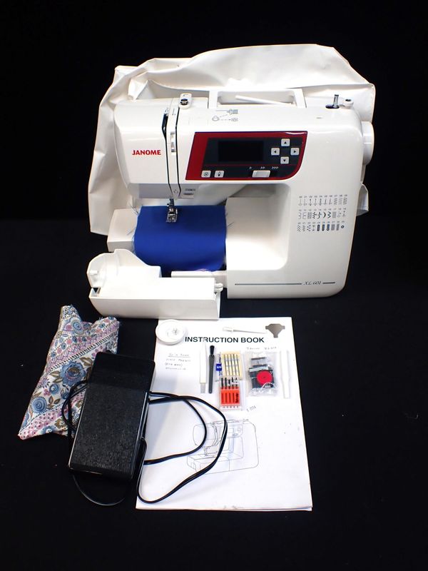 A JANOME XL 601 ELECTRIC SEWING MACHINE