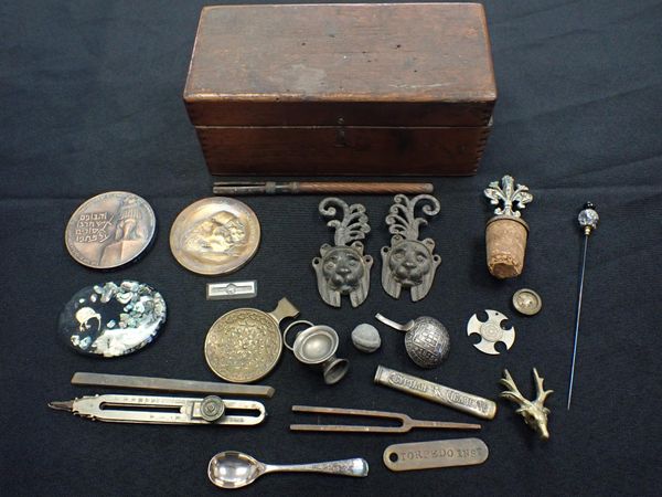 TWO BRONZE MEDALLIONS, A METAL INGOT, WINE STOPPER