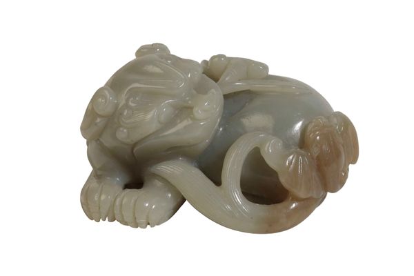 CELADON JADE CARVED FIGURE OF A LION DOG