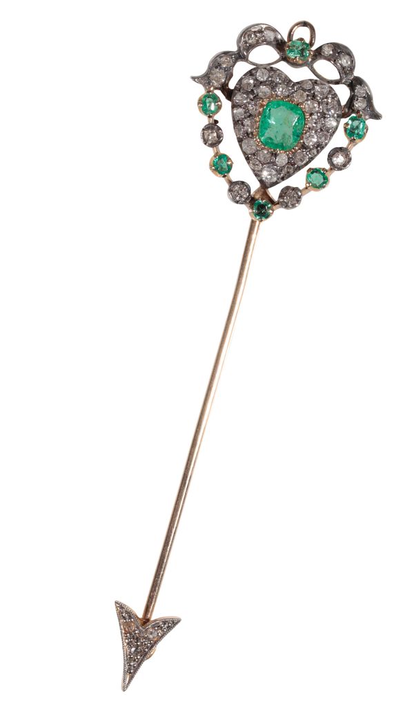 AN EMERALD AND DIAMOND-SET JABOT PIN