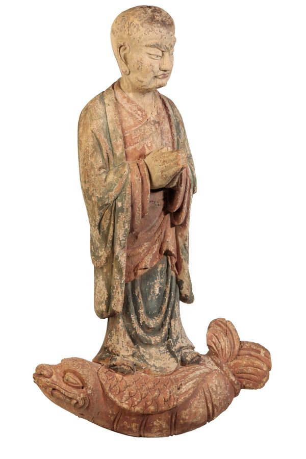 A CHINESE CARVED WOOD AND POLYCHROME LOHAN, PROBABLY LATE MING,