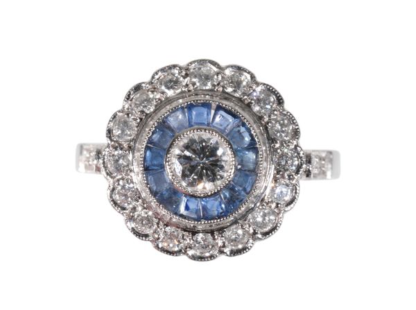 A DIAMOND AND SAPPHIRE TARGET RING