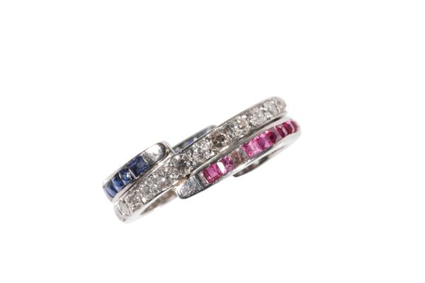 A DIAMOND SAPPHIRE AND RUBY TRIPLE SWIVEL ETERNITY  RING