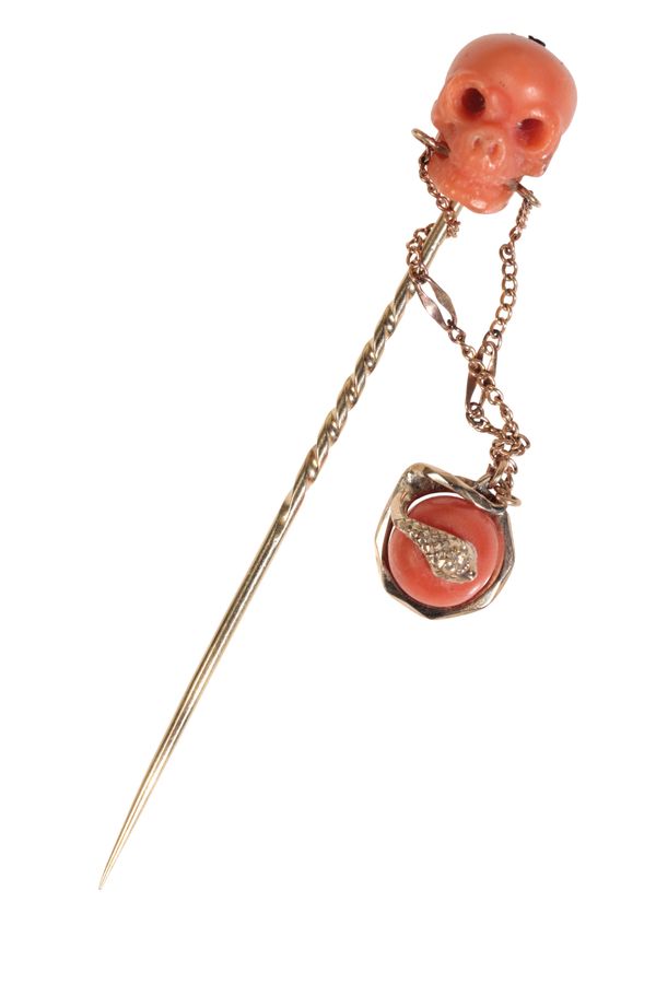 A VICTORIAN CORAL SKULL AND SERPENT STICK PIN