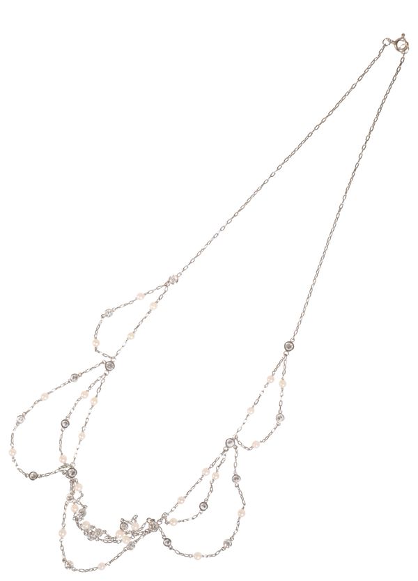 AN EDWARDIAN PLATINUM DIAMOND AND NATURAL SEED PEARL AND FILIGREE CHAIN NECKLACE