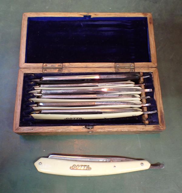 A SET OF RAZORS IN WOODEN BOX