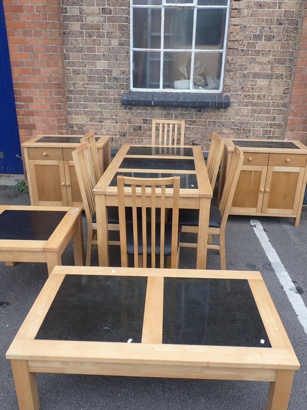 A MODERN LIGHTWOOD DINING SUITE