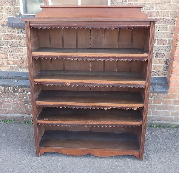 A LATE VICTORIAN OPEN BOOKCASE