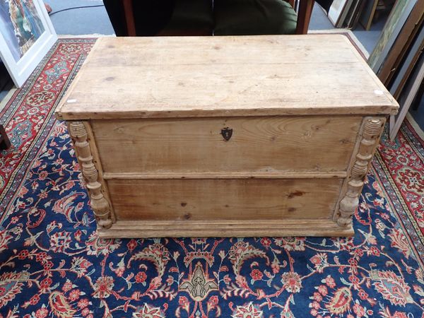 A STRIPPED PINE COFFER WITH  TURNED HALF COLUMNS