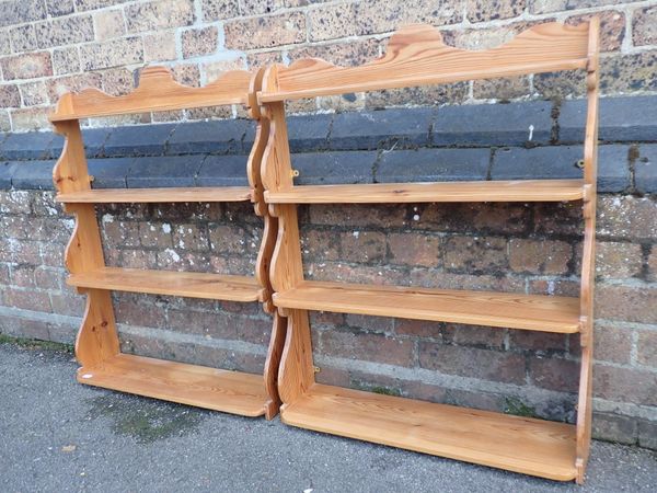 A PAIR OF VICTORIAN STYLE PINE HANGING BOOKSHELVES