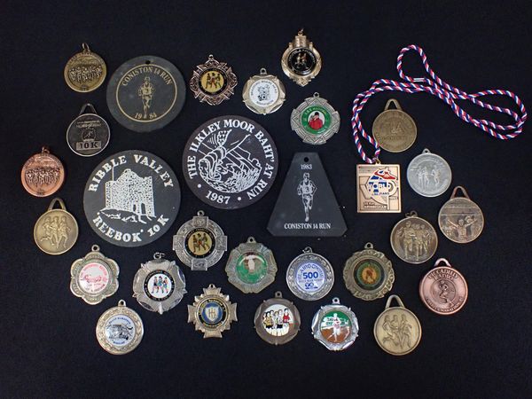 A COLLECTION OF RUNNING MEDALS