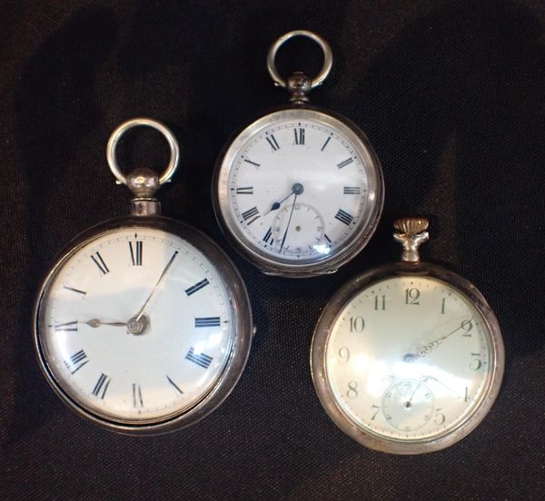A SILVER PAIR CASED POCKET WATCH BY WILLm. SEARLE, NEWLYN