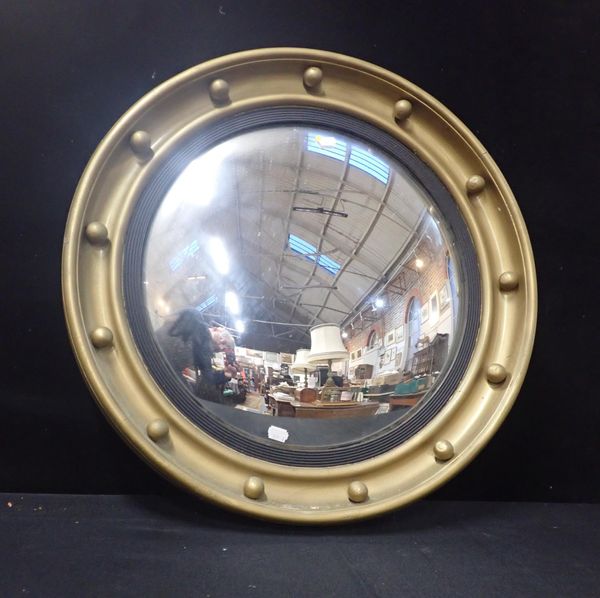 A REGENCY STYLE CONVEX MIRROR, WITH BALL FRAME