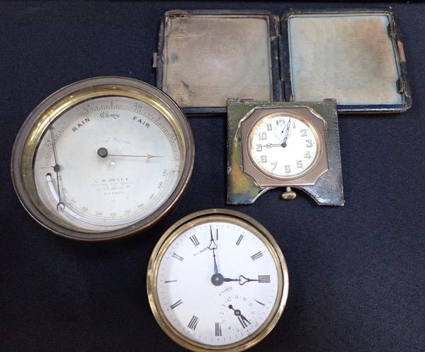 A BRASS-CASED ANEROID BAROMETER BY C.W. DIXEY