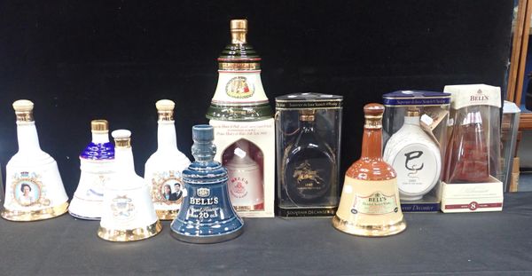 A COLLECTION OF BELLS COMMEMORATIVE WHISKY DECANTERS, CERAMIC AND GLASS