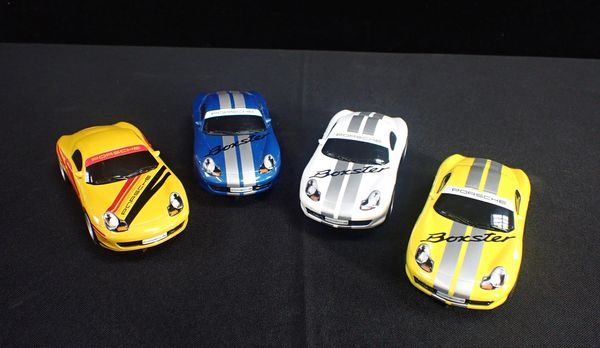 FOUR UNBOXED SCALEXTRIC 'PORSCHE BOXSTER' CARS