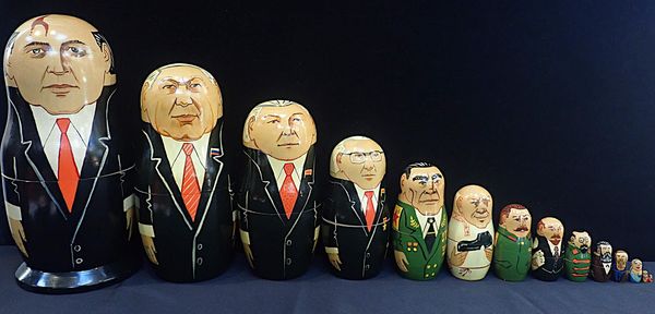 A VINTAGE RUSSIAN MATRYOSHKA SET OF 14 DOLLS OF RUSSIAN LEADERS