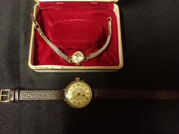 A 14k GOLD CASED WRIST WATCH