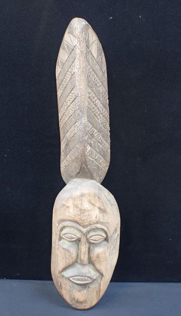 AN AFRICAN MASK WITH TALL COIFFURE CREST