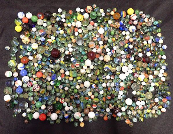 A COLLECTION OF VARIOUS PLAYING MARBLES