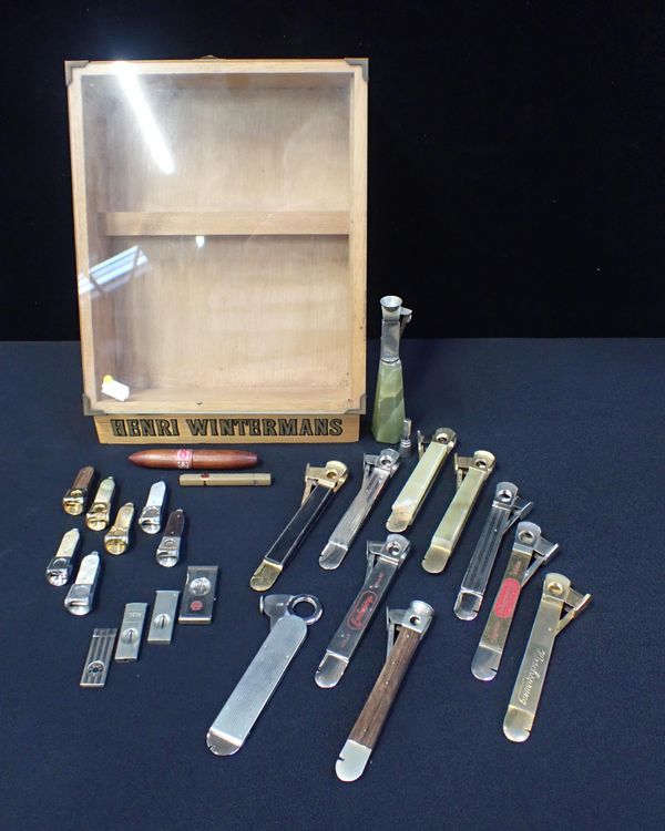 A COLLECTION OF CIGAR CUTTERS