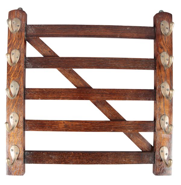 AN EDWARDIAN MAHOGANY WHIP RACK