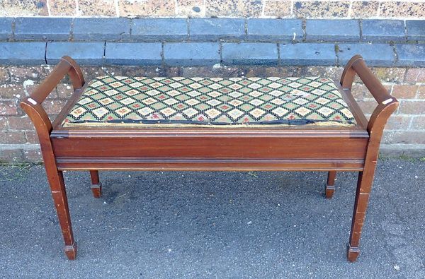 AN EDWARDIAN MAHOGANY DUET PIANO STOOL