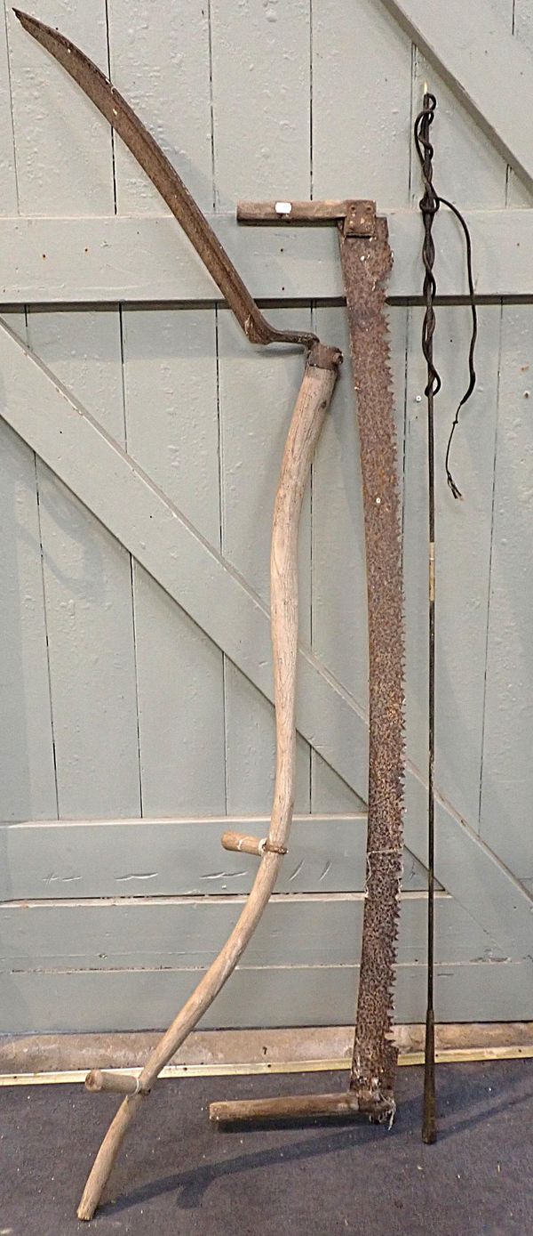 AN ANTIQUE SCYTHE WITH ASH HANDLE