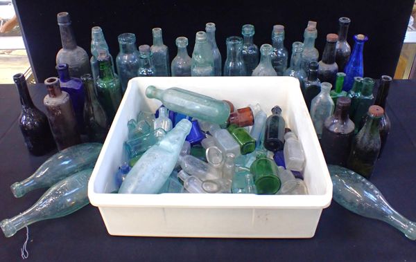 A LARGE COLLECTION OF COLOURED GLASS BOTTLES