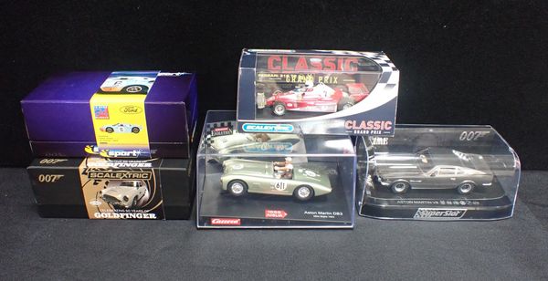 FOUR BOXED SCALEXTRIC CARS