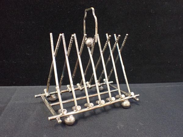 A NOVELTY CROQUET SILVER-PLATED TOAST RACK