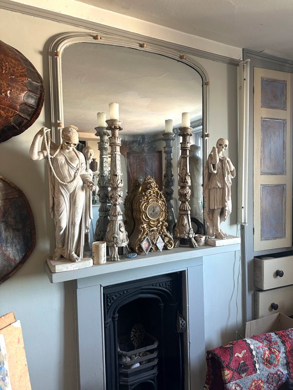 A PAIR OF TALL GREY PAINTED AND CARVED WOOD PRICKET CANDLESTICKS