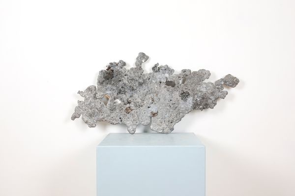 A 20TH CENTURY MOLTEN METAL ABSTRACT SCULPTURE