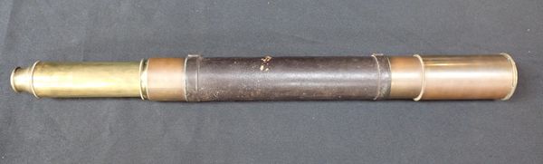A LEATHER COVERED BRASS TELESCOPE