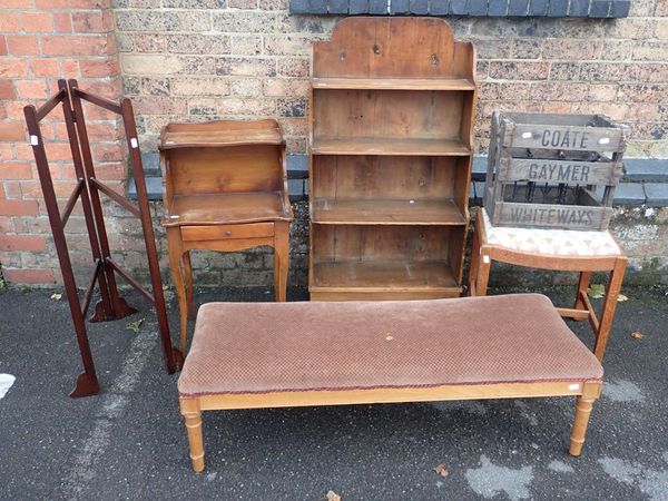 A SMALL STRIPPED PINE WATERFALL BOOKCASE