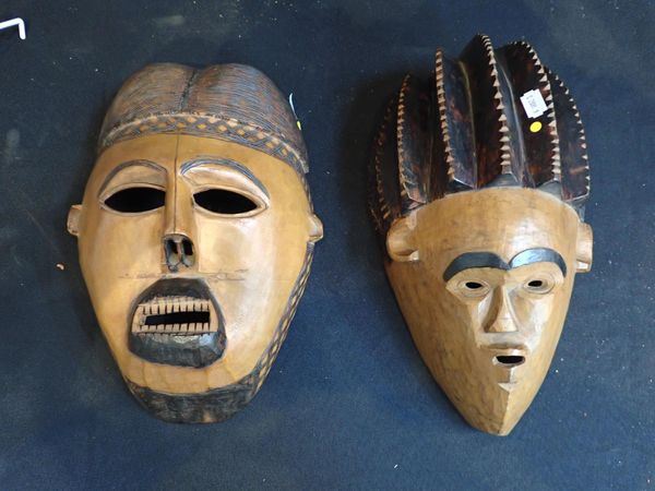 TWO AFRICAN CARVED WOODEN FACE MASKS