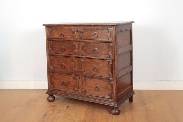 A CAROLEAN STYLE OAK CHEST OF DRAWERS