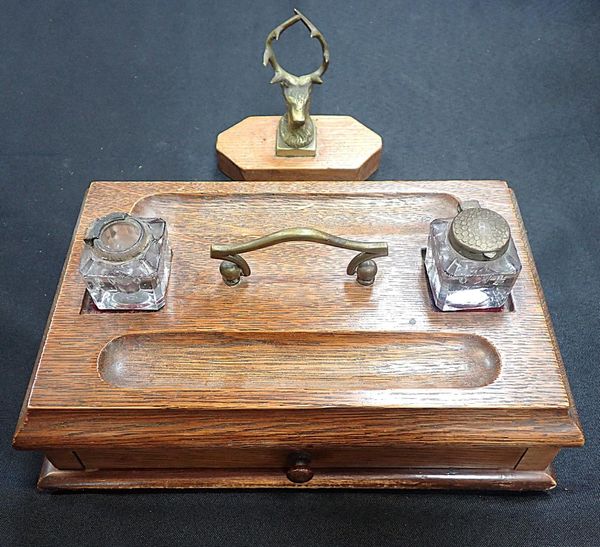 AN EDWARDIAN OAK DESK STAND