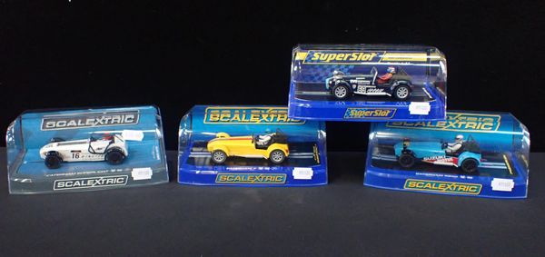 FOUR BOXED SCALEXTRIC 'CATERHAM' CARS